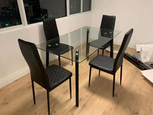 glass dining table with black chair